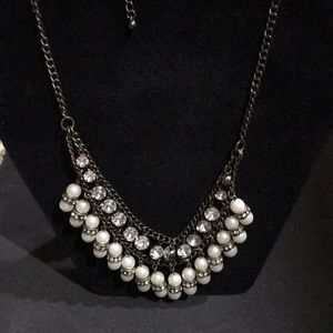 Gold pearl statement necklace.